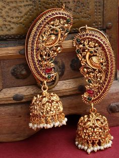 Gold-Plated Pearl & Stone-Studded Peacock Shaped Ear Cuff Earrings VitansEthnics Gold Chandbali Jhumkas With Peacock Design, Gold Bollywood Jhumkas With Peacock Design, Gold Peacock Temple Jewelry Bridal Earrings, Gold Temple Jewelry Bridal Earrings With Peacock Design, Festive Gold Bridal Earrings With Peacock Design, Ornate Jhumkas For Festivals With Pierced Ears, Temple Style Chandbalis For Festivals, Ornate Jhumkas With Latkans For Festivals, Ceremonial Chandbali Jhumkas With Peacock Design