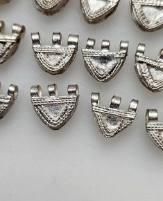 This listing is for 4 beautiful silver tone handmade Ethiopian telsum beads. The average bead size is 12-13MM wide by 11-12 MM long.  Please note that these beads are hand made beads so minor imperfections are to be expected. Item#S2804 You will get the 4 beads similar to the ones shown in pictures. Exact metal content is unknown. The One Show, Mixed Metals, Silver Charms, The 4, Beauty Book, Silver Tone, Hand Made, Charms, Accessory Gift