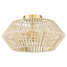 a light fixture made out of wicker with gold trimmings and a metal ring