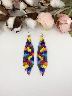 Abstract colorful beaded earrings, boho seed bead earrings, rainbow color earrings, fringe colorful earringsBeautiful rainbow colors matte and shiny. The whole rainbow in one pair of earrings! Elegant and eye catching color comboLength 5” including ear wireWidth 1”Made with high quality Japanese seed beads, and 24k gold dipped seed beads Lightweight and unique extravagant style - designed and made by Luba RoSelect closure earwires leverbacksclip-ons for non pierced ears Yoga Earrings, Seed Bead Jewelry Patterns, Blue Beaded Earrings, Abstract Jewelry, Brick Stitch Earrings, Color Earrings, Earring Ideas, Beading Ideas, Earrings Elegant