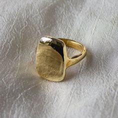 We love this signet ring for the soft, curved lines but strong, bold shape. The irregularity of this heavy ring harkens back to an ancient past. A thick gold ring that is a weighty and substantial piece of jewelry that will last a lifetime. Our number one bestseller, this beautiful big gold ring is created in recycled metals. Details: This modern, organic ring was first created by hand in wax Available in recycled brass or sterling silver, please read brass ring care and cleaning guides before o Open Rings Design, Bold Gold Rings, Brass Rings Handmade, Big Gold Ring, Brass Rings Jewelry, Thick Gold Ring, Silver Ingot, Brass Rings, Organic Rings