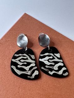 This handmade stylish ceramic earrings would absolutely highlight your day. Modern, chic, lightweight gives you all day wear comfort. It is the prefect gift for her and of course worth having just for yourself. Trendy Black Clip-on Earrings As Gift, Hand Painted Drop Earrings For Everyday, Modern Drop Clip-on Earrings As Gift, Silver Polymer Clay Earrings For Gift, Modern Hand Painted Drop Earrings, Candy Corn Earrings, Butterfly Wing Earrings, Sunflower Earrings, Painted Jewelry