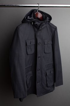 A handmade bespoke coat cut from a lightweight fully-waterproof cotton/poly fabric. This fabric is specifically engineered and guaranteed to keep you completely dry. If you don't have a go-to raincoat, this is the one. A good raincoat not only keeps you comfortable and protects your clothing - but it also makes you stand apart from the crowd with smart, understated style. Cotton Parka With Detachable Hood, Hooded Cotton Raincoat For Rainy Weather, Cotton Raincoat With Pockets For Rainy Weather, Modern Cotton Outdoor Outerwear, Waterproof Cotton Outerwear, Winter Cotton Raincoat For Rainy Weather, Cotton Outerwear With Pockets For Rainy Weather, Cotton Outerwear For Rainy Weather, Winter Cotton Raincoat With Detachable Hood