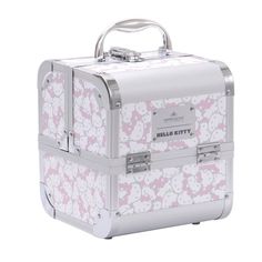 a hello kitty suitcase with pink and white flowers on the front, sitting upright against a white background