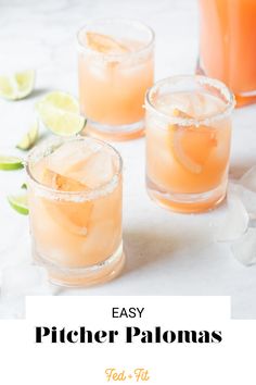 three glasses filled with orange juice and limes on top of a white countertop