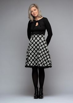 With a high waistband and large retro flowers, the skirt has a trendy modern vintage look.  The black waist skirt is made of soft, stretchy French terry with white large retro flowers. The plate-shaped skirt always cuts a fine figure thanks to its wide swinging skirt and wide waistband. The hem ends with a wide, transparent ruffled border in black.  Simple and yet a little playful.  Hannah wears size S Sizing: BU/TU/HU(+-2cm)  34(XS) 86/66/86  36(S) 90/70/90  38(M) 94/74/94  40(L) 98/78/98  42(XL) 102/82/102  44(XXL) 106/86/106  Total length 34-38 : 60cm Total length 40-44 : 62cm We are also happy to manufacture according to measurements.  Material&Care:  French Terry: 60%cotton, 40%polyester W30o Weiberstyle stands for real handwork made in Austria. Each piece is designed with a lot of lo Retro Black A-line Skirt, Black A-line Retro Skirt, Black Retro A-line Skirt, Black Floral Print Party Skirt, Retro Floral Print Mini Skirt, Retro Mini Skirt With Floral Print, Retro Flared Skirt With Floral Print, Retro Black Flared Skirt, Retro Black Skirt For Spring