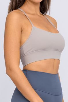 The Qiana Sports Bra - made with our UltraLux Blend, you will be hard pressed to find a better fabric quality than this. Featuring a single back strap for supreme mobility, this sports bra is perfect for that morning jog or a lengthy marathon. This bra will not disappoint, we guarantee it. UltraLux Blend - Superior 80/20 Nylon Spandex Unbelievably Buttery soft Single Back Strap Design for full mobility Perfect for Running Reflective Logo Includes removable cups Tested & Approved by the pros. Sporty Bra With Light Support, Sports Bra With Built-in Padding For Light Exercise, Strappy Back Sports Bra With Padding For Yoga, Fitted Sports Bra With Adjustable Straps For Training, High Stretch Light Support Sports Bra For Gym, Supportive Activewear With Built-in Bra For Light Exercise, Supportive Training Bra, Solid Color Athleisure Sports Bra With Adjustable Straps, Athleisure Bra With Light Support For Gym