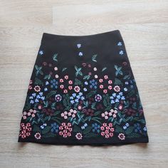 Zara Floral Embroidered Mini A-Lined Skirt Zip Lined Black 100% Polyester Condition Is Pre-Owned In Good Condition. Please Note: -The Real Color Of The Item May Be Slightly Different From The Pictures Shown On Website Caused By Many Factors. -Don't Go By Size Number, Do Check Measurements Listed Below To Determine If The Item Will Fit. Measurements: Approximately (Laying Flat). -Waist: 15 Inches -Hip: 20 Inches -Length: 20 Inches The Condition Guide: -New With Tags - Never Been Used Condition. T Zara Embroidered Fitted Skirt, Fitted Embroidered Zara Skirt, Zara Embroidered Skirt For Spring, Spring Embroidered Skirt From Zara, Fitted Multicolor Embroidered Skirt For Spring, Fitted Skirt With Multicolor Floral Embroidery, Reworking Clothes, Zara Skirts, Lined Skirt