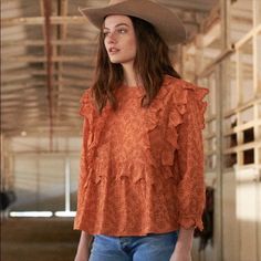 Very Good Condition Fun And Feminine Top From The Great. This Flutter Sleeve Eyelet Top Is In The Color Spice Which Is A Rich Orange Color. It Has Three Quarter Sleeves, Ruffles On The Shoulders, Bib, And Cuffs, And A Crew Neckline. Pair It With Jeans For A Casual Look Or Slacks For Work Wear. Brand: The Great. Size 1 Long Sleeve Fabric: Not Listed, Feels Like Cotton. Flowy Fall Tops With Ruffle Hem, Flowy Ruffle Hem Top For Fall, Flowy Top With Ruffle Hem For Fall, Fall Ruffle Hem Blouse With Ruffle Sleeves, Flowy Ruffled Tops For Daywear, Fall Ruffled Tops For Daywear, Ruffled Tops For Daywear In Fall, Fall Ruffle Sleeve Blouse With Ruffle Hem, Fall Blouse With Ruffle Hem And Ruffle Sleeves