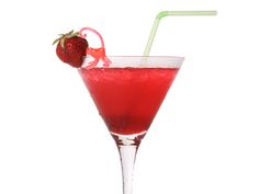 a red drink in a glass with a straw and a strawberry on the rim