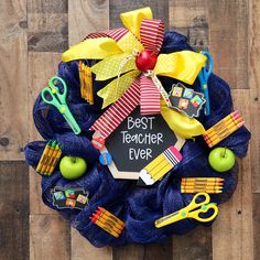 a wreath that has some school supplies on it