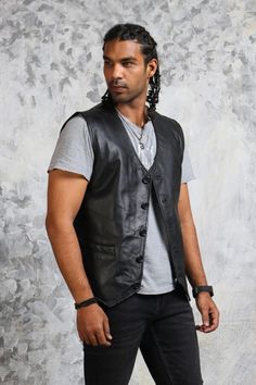 Classic Leather Vest For Biker Events, Sleeveless Leather Jacket For Biker Events, Sleeveless Black Biker Jacket For Biker Events, Moto Style Black Vest For Biker Events, Black Moto Vest For Biker Events, Black Rocker Style Vest For Streetwear, Black Leather Moto Vest, Sleeveless Biker Leather Vest, Sleeveless Biker Leather Vest Jacket