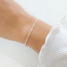 "Elegant Sterling Silver Figaro chain bracelet for Women, Classic Silver Jewelry An adorable bracelet that will definitely become your favorite one. This is the perfect bracelet to wear on its own or stacked with other bracelets. It will be a great addition to your jewelry collection and pairs well with both, informal and formal outfits ~ << ✦ ✥ ✥ ✥ ✦ >> ~ ► Material: All components in this bracelet are 925 sterling silver ► Measurement: Bracelet length - 6.5\" + Chain extension - 1\ Minimalist Figaro Chain Bracelet, Minimalist Adjustable Nickel-free Chain Bracelet, Minimalist White Jubilee Chain Bracelet, Dainty Nickel-free Chain Bracelet For Everyday, Minimalist Adjustable Figaro Chain Bracelet, Minimalist Everyday Friendship Bracelets, Dainty Nickel-free Sterling Silver Bracelet, Nickel-free Dainty Sterling Silver Bracelet, Adjustable Figaro Chain Bracelet As Gift