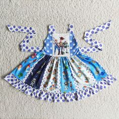 the dress is made out of fabric and has blue polka dots on it, with an image of dr seuss