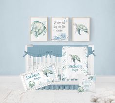 a baby crib bedding set with sea turtle prints on the wall and pillows