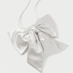 Evening Crossbody Bag In Cream Satin With An Oversized Bow. Features A Magnetic Closure And Lined Interior. Dimensions W: 4.5" X D: 0.5" X H: 7" 20" Strap Drop Materials 72% Viscose 28% Silk Elegant Formal Shoulder Bag With Bow, Elegant Evening Bag With Satin Bow, Elegant Evening Bags With Satin Bow, Elegant Bags With Bow For Events, Elegant Formal Bag With Satin Bow, Formal Shoulder Bag With Detachable Bow, White Feminine Evening Bag, White Luxury Shoulder Bag For Events, Chic Formal Bags With Satin Bow