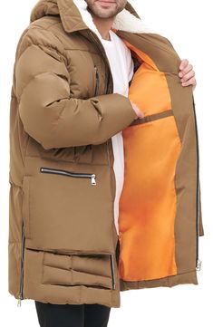 Stay warm in this heavyweight water-resistant parka constructed with a faux shearling–lined hood, roomy bellows pockets and side zip vents. 35" length Front zip closure Drawcord-toggle hood Chest zip pockets; front zip pockets; side-seam pockets; interior welt pocket Side zip vents Lined, with 100% polyester faux-shearling hood lining; 100% polyester fill 100% polyester Machine wash, tumble dry Imported Winter Down Parka With Fleece Lining, Winter Parka With Zipper Closure, Utility Puffer Jacket For Winter, Brown Hooded Jacket With Pockets For Cold Weather, Brown Winter Puffer Jacket With Pockets, Khaki Puffer Jacket With Pockets For Cold Weather, Winter Utility Parka With Fleece Lining, Brown Parka With Pockets For Winter, Winter Brown Parka With Pockets