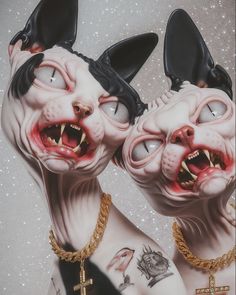 two spooky cats with chains around their necks