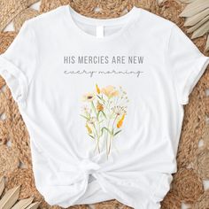 This Christian botanical women's shirt features the beautiful scripture verse - His mercies are new every morning - Lamentations 3 v23, featuring wildflowers painted in watercolor.  This encouraging bible verse reminds us that God's grace and mercy are forever renewing all things.  A perfect gift for Christian moms, especially those with a love of flowers and gardening.   ABOUT YOUR SHIRT: ☀ Super soft and comfortable jersey t-shirt made of premium combed and ring-spun cotton, featuring a crew n Scripture T Shirts For Women, Inspirational Relaxed Fit T-shirt For Spring, Bible Mom Shirt, Jireh You Are Enough Shirt, Christian Mom Gifts, Butterfly Christian Shirt, Scripture Shirt, New Every Morning, Beautiful Scripture