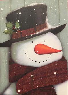 a snowman wearing a hat and scarf