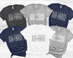 Proud air force family Custom T-shirt/Personalized shirt! This will be perfect for air force graduation family matching T-shirts. Please choose color, size, and enter custom text (mom, dad, etc..) in personalization and add to cart. Please repeat as you need. This classic unisex jersey short sleeve tee fits like a well-loved favorite. Soft cotton and quality print make users fall in love with it over and over again. These t-shirts have-ribbed knit collars to bolster shaping. The shoulders have t Air Force Sister Shirts, Air Force Mom Shirt, Air Force Graduation, Air Force Family, Graduation Shirts For Family, Air Force Families, Matching Family Shirt, Air Force Shirt, Family T Shirts