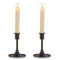 two candles sitting on top of each other