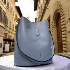 This bag has been made of the best genuine leather by local master crafters of Florence in Italy, designed for women who only accept premium Italian quality and luxury leather bags and modern Italian fashion. . Size: Width: 27 cm / 10.75 inches Height: 19 cm / 7.50 inches Depth: 9 cm / 3.50 inches Color: Stone Blue . The story of this bag : Once upon a time, in the charming city of Florence, Italy, renowned for its exquisite artistry and craftsmanship, there existed a small workshop tucked away Elegant Bucket Shape Bag With Leather Lining, Elegant Leather Bucket Shape Satchel, Elegant Leather Bucket Satchel, Smooth Grain Bucket Shoulder Bag For Everyday Use, Everyday Smooth Grain Bucket Shoulder Bag, Elegant Leather-lined Bucket Shoulder Bag, Elegant Bucket Shape Shoulder Bag With Leather Lining, Luxury Smooth Grain Bucket Bag For Daily Use, Smooth Grain Bucket Bag