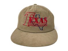 Vintage Texas hat. Corduroy crown with a snapback closure and embroidered graphics Brand: N/A Size: Adjustable (One Size Fits Most) Condition: Good Flaws: Faint staining along the sides of the crown Vintage Snapback Dad Hat With Embroidered Logo, Retro Dad Hat With Embroidered Logo Snapback, Embroidered Logo Corduroy Hat For Streetwear, Streetwear Corduroy Hat With Embroidered Logo, Corduroy Hat With Embroidered Logo For Streetwear, Corduroy Flat Brim Baseball Cap For Streetwear, Corduroy Snapback Hat For Streetwear With Curved Brim, Corduroy Snapback Hat For Streetwear, Vintage Corduroy Trucker Cap