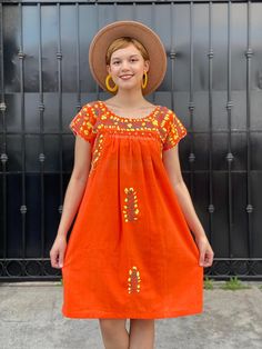 "Mexican floral embroidery vintage dress, cotton short sleeve tunic, bohemian beach wedding, neon orange summer dress, flor oaxacan sundress Elegant dress and colourful hand-embroidery. Perfect for mexican wedddings, mexican parties, etc. Made in the 80's Colour: Neon orange and floral embroidery in grey and yellow. Loose fit Fits size SMALL (Maybe medium, check measurements) Armpit to armpit 21 1/4\" Bottom hem width 28\" Shoulders to bottom hem 37 1/2\" NOTE: In the first 3 pics, you can see t Bohemian Orange Summer Dress, Embroidered Short Sleeve Boho Summer Dress, Orange Bohemian Cotton Dress, Boho Short Sleeve Dress With Floral Embroidery For Beach, Short Sleeve Boho Dress With Floral Embroidery For Beach, Short Sleeve Boho Sundress For Festivals, Summer Folk Style Embroidered Dress With Short Sleeves, Folk Style Embroidered Short Sleeve Summer Dress, Folk Style Embroidered Short Sleeve Dress For Summer