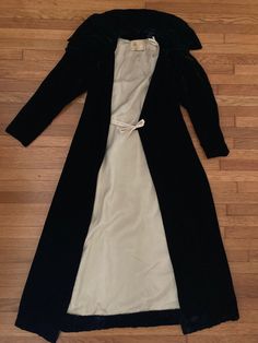 "1930s rich black rayon velvet opera coat has a  button at the collar with and side tie and a velvet covered button at the waist(which can be moved if you need another inch or three! Elegant coat has mutton sleeves and oversized flat collar and is lined in a cream acetate which does have a couple stains, but is in overall very good condition.  Made by Conrad & Co. in Boston Shoulders 15\" across Chest 32\" Waist 26\" Sleeve Length from shoulder seam to cuff 23\" Length from back of neck to hem 5 Elegant Velvet Outerwear For Costume, Vintage Velvet Outerwear For Costume, Vintage Velvet Costume Outerwear, Vintage Black Velvet Outerwear, Black Velvet Vintage Outerwear, Black Vintage Velvet Outerwear, 1930s Coat, Opera Coat, Elegant Coats