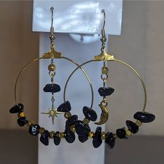 Mismatched Black And Gold Crystal Obsidian Chip Bead Moon And Star Hoop Earrings. Bead Size And Color May Vary Slightly As These Are Made To Order. Comes On Fish Hook Earrings. Handmade Black Dangle Hoop Earrings, Bohemian Black Metal Hoop Earrings, Black Dangle Hoop Earrings For Festivals, Handmade Black Hoop Earrings For Festival, Black Celestial Earrings With Moon Charm, Black Moon Charm Celestial Earrings, Black Moon Shaped Celestial Earrings, Black Moon-shaped Celestial Earrings, Celestial Moon-shaped Black Earrings