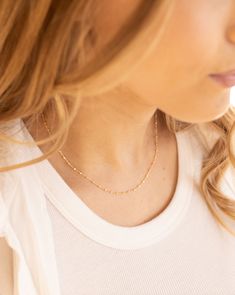 Add some dazzle to your daily stack with the Camilla Necklace. This sparkling piece will elevate any look, perfect for any occasion. Details: - Gold filled - 16" length + 2" adjustment - Hypoallergenic & Waterproof Dainty 14k Gold-filled Necklaces With Adjustable Chain, Delicate 14k Gold-filled Dangle Charm Necklaces, Delicate 14k Gold Tarnish-resistant Chain Necklace, Delicate 14k Gold-filled Charm Necklace, Tarnish Resistant, Dainty 14k Gold-filled Satellite Chain Necklace, Stackable Necklaces, Gold Bead Necklace, Everyday Necklace, Adjustable Necklace