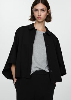 Cape jacket with buttons - Women | MANGO USA Chic Oversized Cape For Workwear, Chic Oversized Workwear Cape, Workwear Cape Outerwear With Button Closure, Workwear Cape With Button Closure, Fall Workwear Cape With Button Closure, Spring Chic Workwear Cape, Cape-style Buttoned Outerwear For Work, Modern Cape For Workwear, Modern Fall Tops With Placket