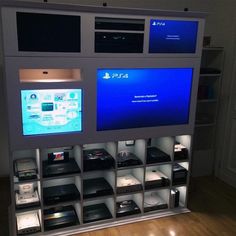 an entertainment center with many electronic devices on display