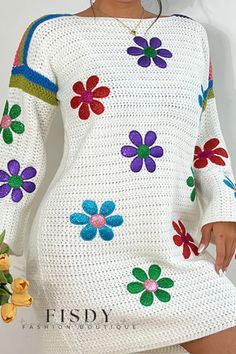 a woman is wearing a white dress with colorful flowers on the sleeves and bottom half