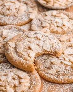 a pile of cookies covered in powdered sugar