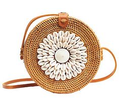 This eclectic circular woven bag is total arm candy! Its alluring design features a cluster of shells at the center with a hazelnut brown strap that can be worn on the shoulder or across the body. From Jelavu. Brown Summer Shoulder Bag Fashion Accessory, Shell Purse, Woven Bag, Arm Candy, Fashion Handbags, Straw Bag, Shells, Handbags, Design