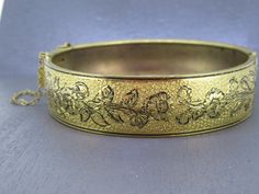 Stunning vintage hinged bracelet with beautiful floral detailing, stunning piece.  Has a box clasp that works great.  Great detail.  Has some age related wear and patina. Signed with a patent.  Visit Ribbons Edge for more great pieces of vintage and antique jewelry!  All items added to your cart at Ribbons Edge will automatically combine shipping. To stay up to date with my newest offerings, follow me on IG @ RibbonsEdge Vintage Hinged Cuff Bracelet, Vintage Cuff Bracelet With Intricate Design For Formal Events, Vintage Cuff Bracelet With Intricate Design For Formal Occasions, Vintage Hinged Bracelets For Wedding, Vintage Hinged Bangle Bracelet, Vintage Hinged Bangle, Victorian Etched Cuff Bracelet For Formal Occasions, Vintage Hinged Bangle For Formal Occasions, Vintage Hinged Bangle As Gift