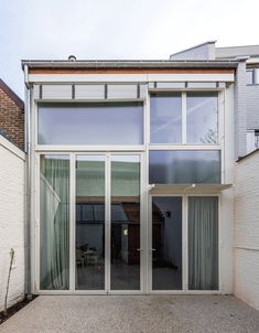 an open patio with sliding glass doors leading to the outside