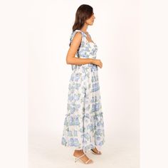 Make a statement in this dreamy dress! This midi dress features a sweetheart neckline, tie close shoulder straps, and padded cups in the bust for extra support and to top it all off, this dress is made with a blue floral chiffon overlay for an elegant touch. Perfect for any special occasion. Blue Maxi Dress With Tie Straps For Garden Party, Spring Blue Dress With Knotted Straps, Blue Dress With Knotted Straps For Spring, Garden Party Maxi Dress With Tie Straps, Ruffled Straps Dresses With Tie Straps And Fitted Bodice, Fitted Bodice Midi Dress With Tie Straps For Brunch, Blue Sundress With Adjustable Straps For Garden Party, Blue Spaghetti Strap Midi Dress For Garden Party, Sundress With Sweetheart Neckline And Knotted Straps