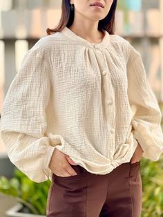 Beige Blouse With Button Closure For Vacation, Beige Long Sleeve Shirt For Vacation, Beige Long Sleeve Vacation Shirt, Beige Button Tops For Beach, Beige Long Sleeve Tops For Vacation, Beige Buttoned Tops For Beach, Long Sleeve Beige Tops For Vacation, Beige Buttoned Beach Tops, Beach Long Sleeve Blouse With Button Closure