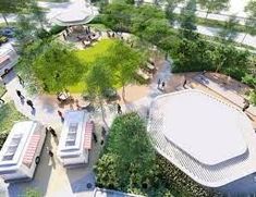 an aerial view of a park with benches and trees