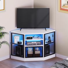 an entertainment center with speakers and a flat screen tv