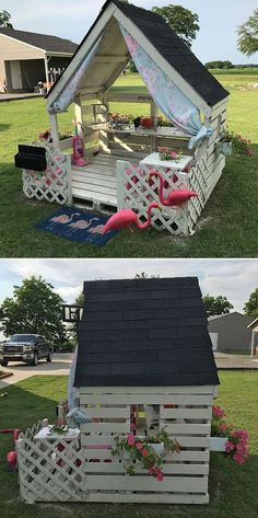 a small house made out of wooden pallets with flowers and pink flamingos on the roof