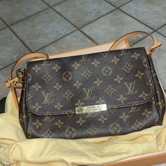 Condition Is Very Good/ Used But Very Well Loved - Purchased In 2016 - Smoke Free Home And Stored Well Size And Fit 9.5"W X 6.5"H X 2"D 7" Handle Drop 21" Strap Drop Been Sitting In Dust Bag And Box For A While. Strap And Chain Looks Brand New Elegant Shoulder Bag With Monogram Print And Coated Canvas, Elegant Shoulder Bag With Monogram Print For Shopping, Formal Bags With Monogram Print, Elegant Tan Monogram Bag, Elegant Monogram Print Shoulder Bag For Shopping, Tan Monogram Bag, Elegant Shoulder Bag With Monogram Print, Classic Monogram Print Shoulder Bag, Elegant Gold Monogram Bag