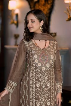 This Suit is a suitable amalgamation of style and grace that is required from ethnic wear. The dress is ideal for any formal or informal gathering. Crafted with the utmost care, our plazzo suits are made from high-quality fabrics that offer comfort and breathability, allowing you to move effortlessly. The highlight of our salwar suit, is meticulously designed to enhance your beauty. It comes in a range of stunning styles, catering to diverse occasions and preferences. Chest Size: Medium: 38 Inch Traditional Floor-length Formal Salwar Kameez, Festive Bollywood Suit With Dupatta, Unstitched Formal Sharara For Eid, Traditional Palazzo Set With Dabka For Party, Traditional Festive Georgette Suits, Anarkali Suits With Dupatta For Eid, Formal Dabka Sharara For Eid, Dabka Sharara For Eid And Formal Occasions, Elegant Brown Dress With Dupatta