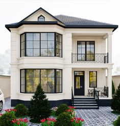 a large white two story house with lots of windows