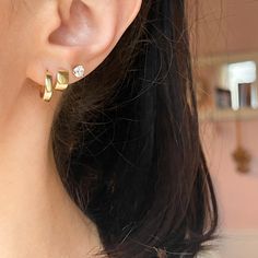 14KT yellow gold hinged huggie hoop earrings. Great, small, hoops for everyday wear! Length: 12.8mm Width: 13.50mm Shown in first ear hole Thickness: 3mm Weight: 1.82 grams Stamped 14K 14K solid gold One pair Hollow hoops Post, notch + lock closure Secure locks Minimalist Prong Setting Huggie Earrings, Classic Internally Threaded Huggie Hoop Earrings, Classic Huggie Everyday Piercings, Classic Huggie Internally Threaded Piercings, Classic Internally Threaded Huggie Piercings, Classic Huggie Piercings For Everyday, Modern Everyday Huggie Piercings, Modern Huggie Piercings For Everyday, Modern Huggie Piercings