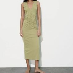 Dress Made Of Knit Fabric. Sleeveless With V-Neckline And Ruffle Detail. Hidden In-Seam Zip Closure. Apple Green Green Stretch V-neck Sleeveless Dress, Green V-neck Stretch Sleeveless Dress, Green V-neck Sleeveless Stretch Dress, Sleeveless V-neck Dress With Ruched Detail And Stretch, Sleeveless Ruched Stretch Dress With V-neck, Sleeveless Ruched V-neck Dress With Stretch, Casual Ruched V-neck Summer Dress, Yellow Stretch V-neck Maxi Dress, Zara Sleeveless Ruched Midi Dress