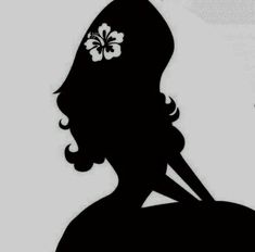 the silhouette of a woman with a flower in her hair